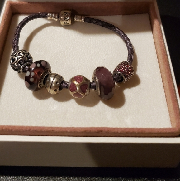 Like brand new pandora Leather nice bracelet 6 charms comes with it. - Picture 3 of 3